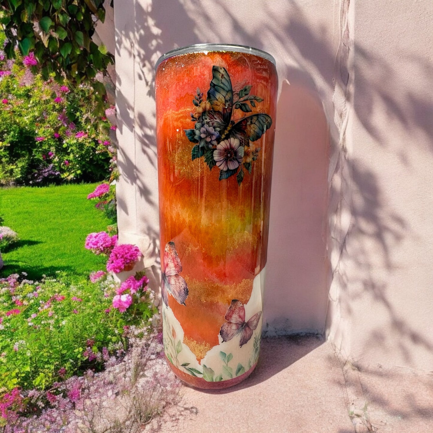 Butterfly 20 oz tumbler with orange background