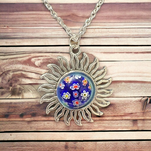 Silver sun pendant with hand painted flowers