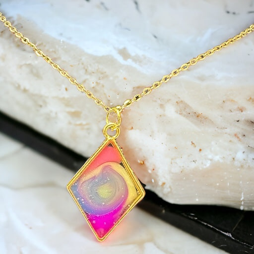 Color splash on gold pendant necklace