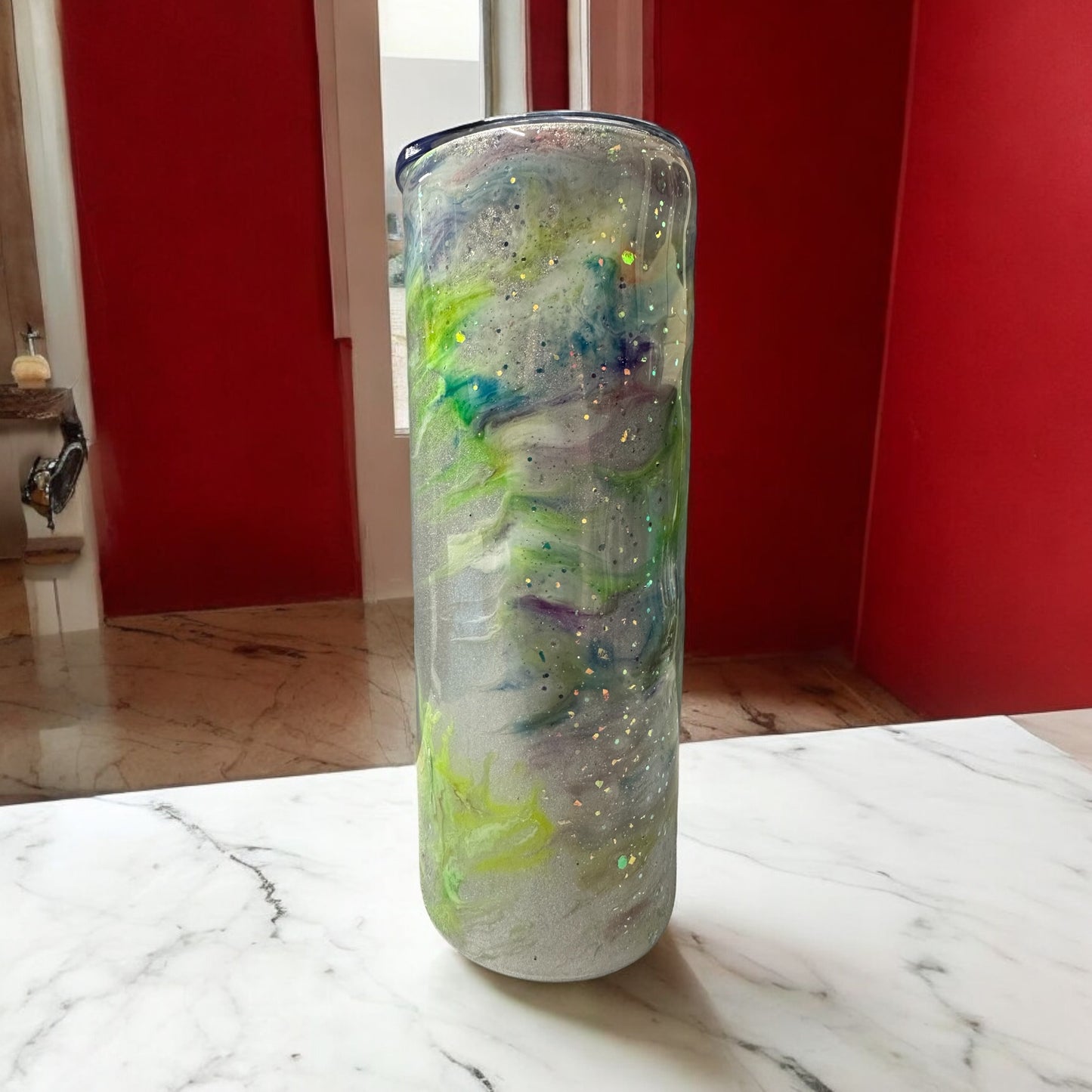 Silver 20 ox tumbler with swirls of green,yelow and blue